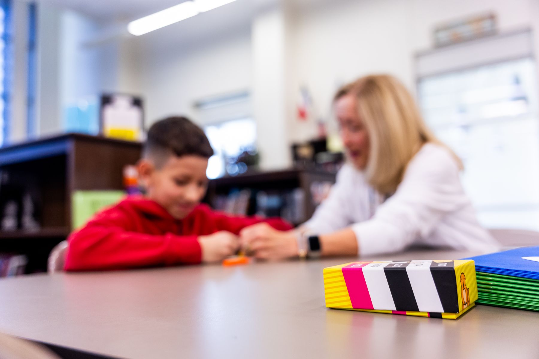 A child learning alongside an educator